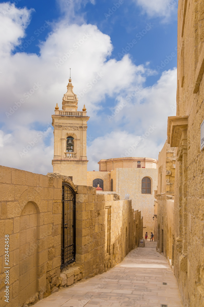 Victoria, the island of Gozo, Malta. Street inside the Citadel and the bell tower of the Cathedral