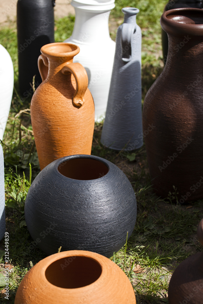 Clay vessels of handwork of various shapes and colors. Articles of pottery Clay vessels of handwork of various shapes and colors. Articles of pottery
