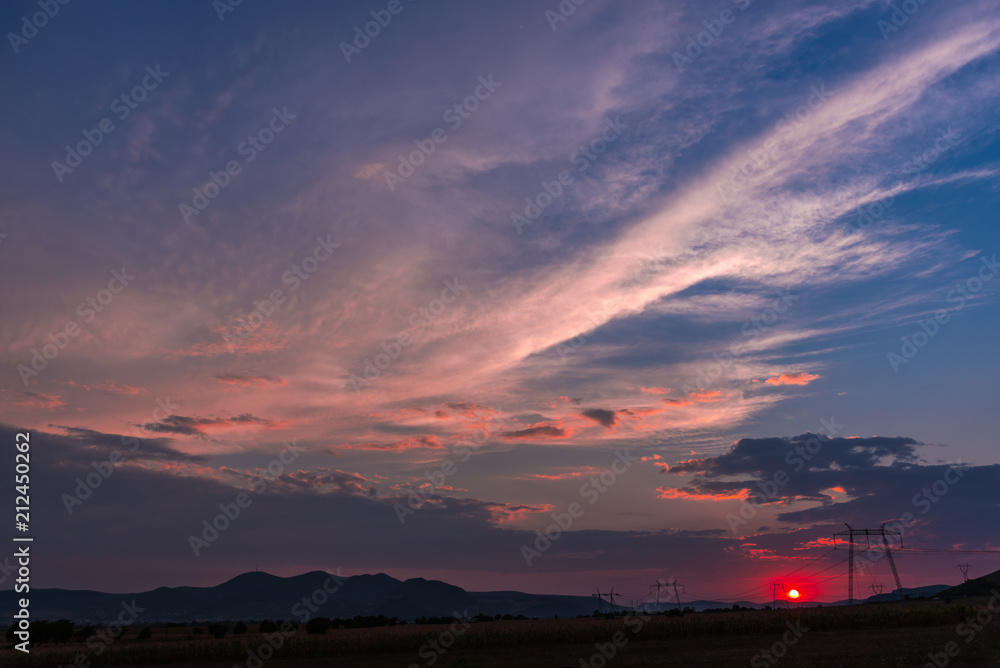 Dramatic clouds on the sky at the sunset