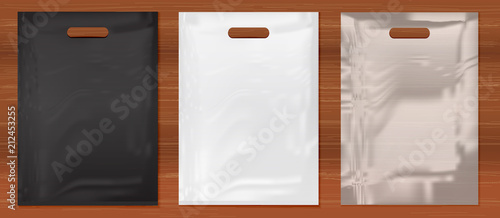 Quality Plastic Bags on wooden background,white,black,transparent plastic bag.Mockup set of Realistic Shopping Bag for branding and corporate identity design.Vector set mock up.