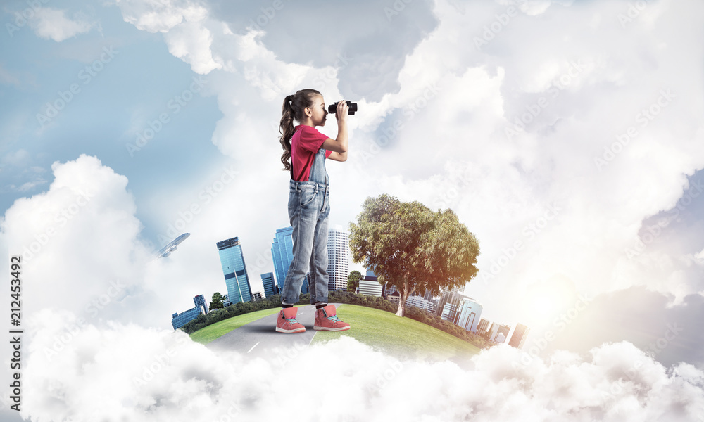 Concept of careless happy childhood with girl looking in future Concept of careless happy childhood with girl looking in future