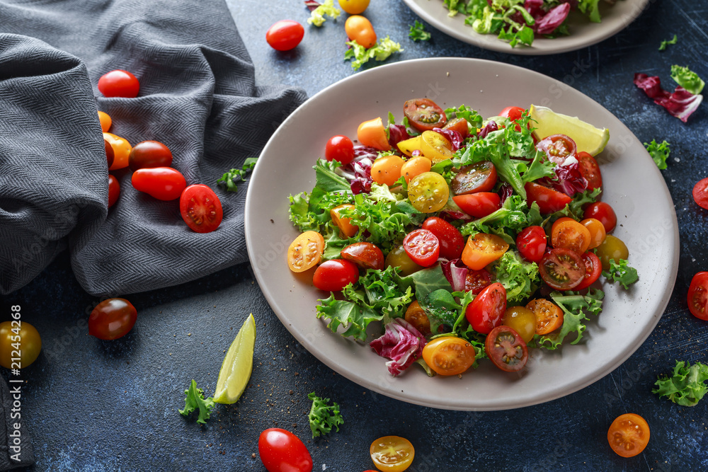 Fresh Cherry Tomato mix salad with lettuce, lemon, lime, black pepper and sea salt. healthy food Fresh Cherry Tomato mix salad with lettuce, lemon, lime, black pepper and sea salt. healthy food