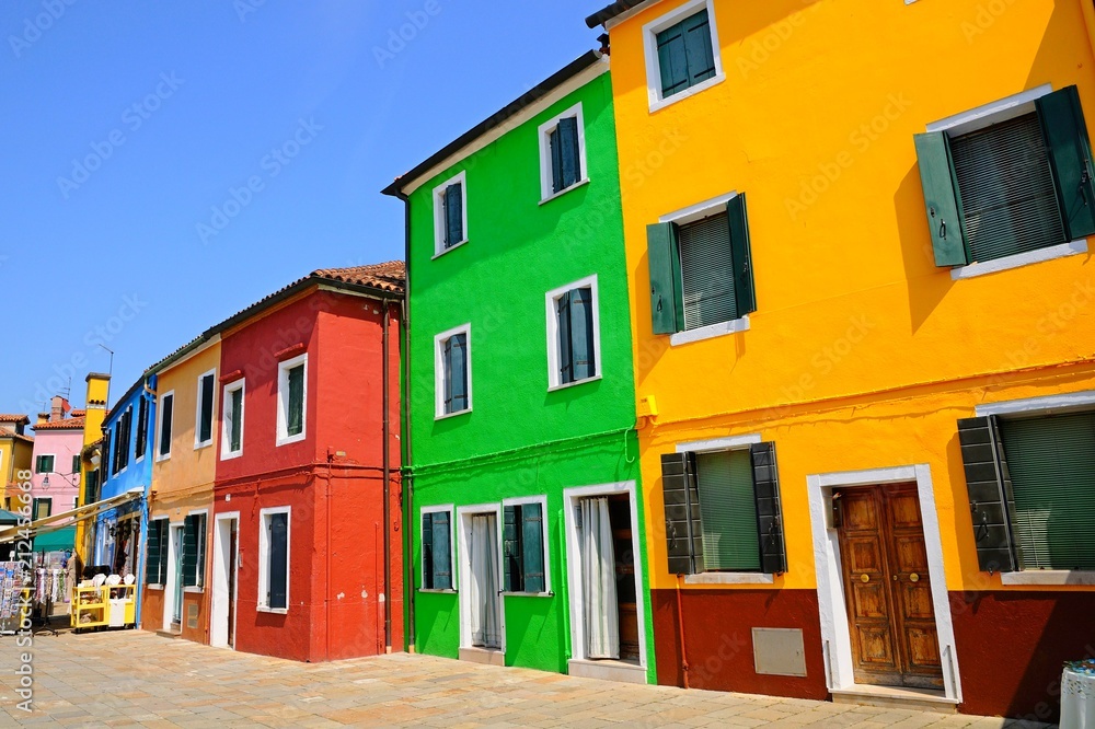 Street with colorful buildings and houses in Burano island, Venice, Italy - Famous Architecture and landmarks