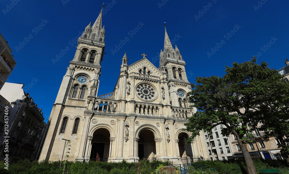 The Saint-Ambroise church soars into blue sky in French capital Paris.