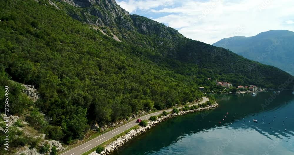 Aerial view of the mountain roads near Kotor bay and villages along the coast. Aerial view of the mountain roads near Kotor bay and villages along the coast.