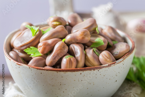 Closeup of delicious broad beans in old white kitchen