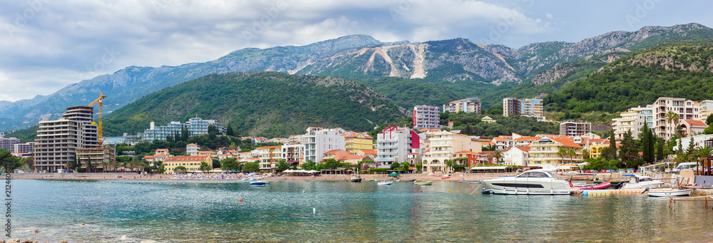 View on the town Becici surrounded by the mountains, before the storm, dramatic clouds near Budva city at Adriatic sea coastline, Montenegro. summer seascape