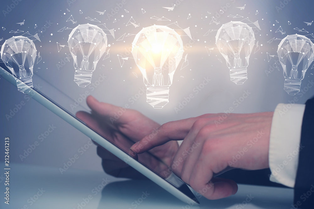 idea concept with digital tablet and bulbs idea concept with digital tablet and bulbs