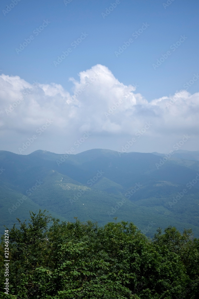 Cumulus clouds above the mountains
