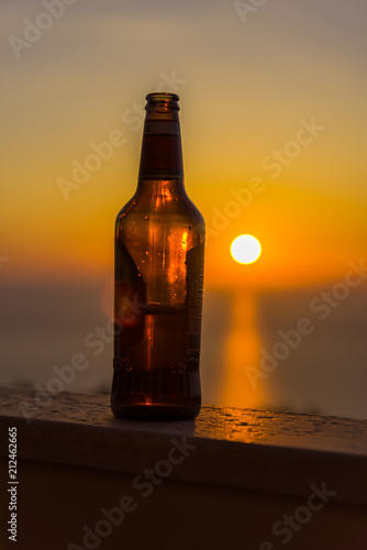 Beer bottle at the sunset