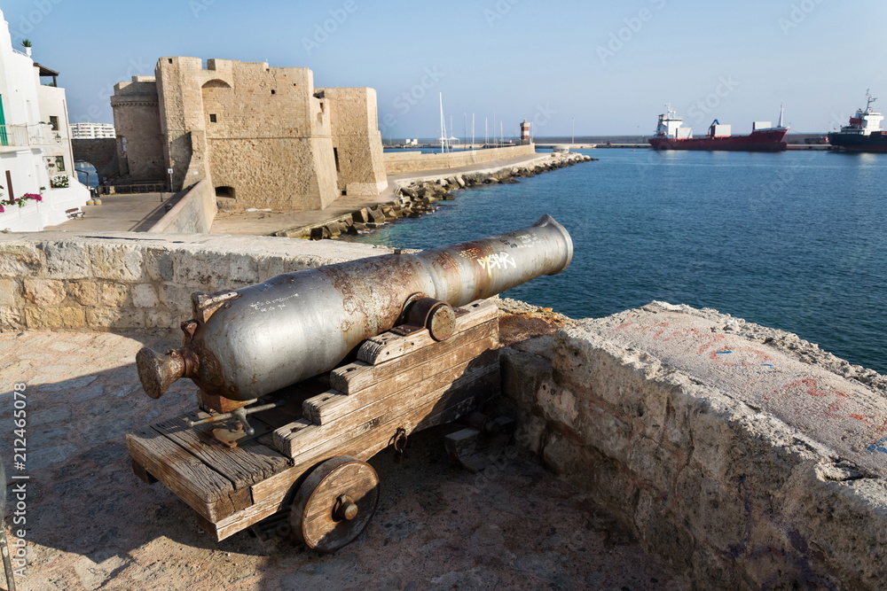 Artillery cannon gun in front of Carlo V Castle in port Monopoli, Apulia, Bari province, Italy