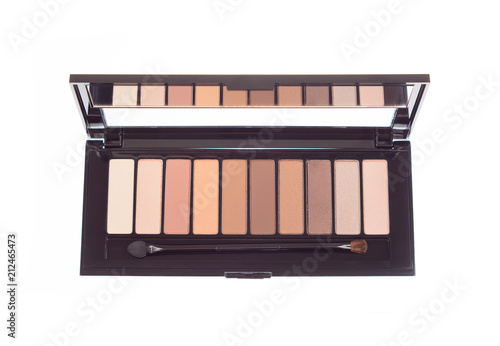Obraz na płótnie Open new eyeshadow colorful vivid palette. Cosmetics kit for eyes makeup. Gloss and matte tints in one box isolated on white background. Brown yellow nude color shades. View from top w salonie