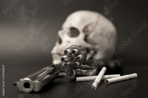 Smoking cigarette like suicide with gun,dangeruous to lung,smoking quit concept. photo