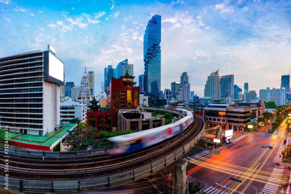 Obraz premium Aerial view of Bangkok modern office buildings and condominium in Bangkok city downtown with blue sky and clouds at Bangkok, Thailand. BTS skytrain