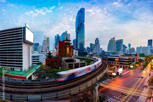 Aerial view of Bangkok modern office buildings and condominium in Bangkok city downtown with blue sky and clouds at Bangkok, Thailand. BTS skytrain photo