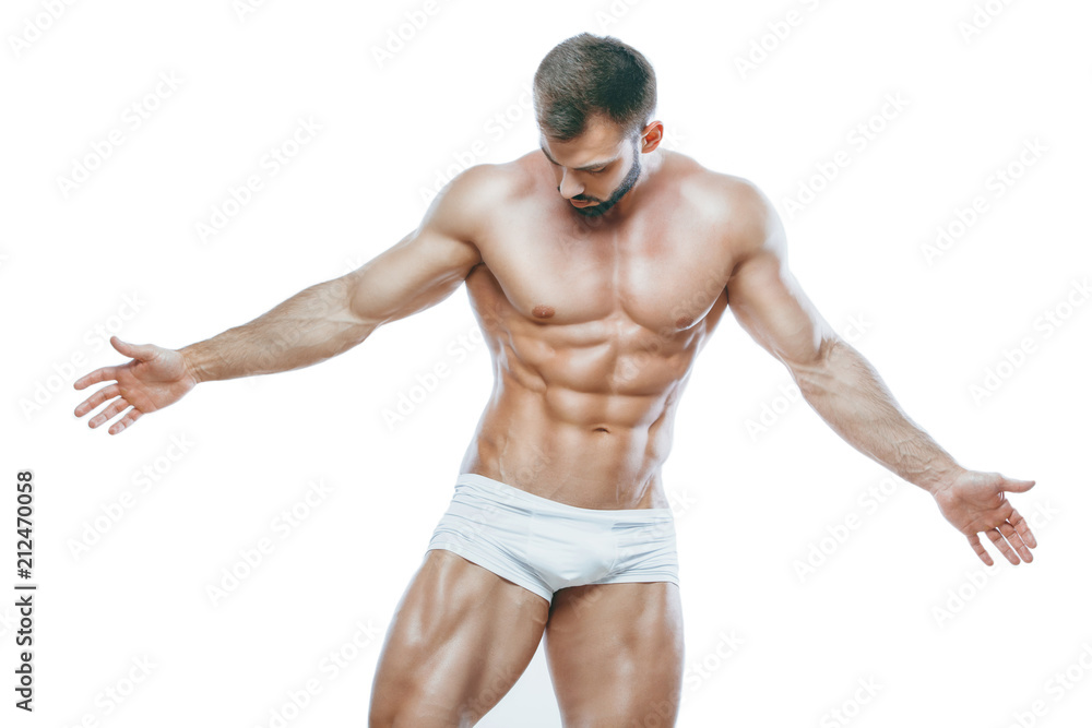 bodybuilder posing. Beautiful sporty guy male power. Fitness muscled manin white lingerie. on isolated white background. bodybuilder posing. Beautiful sporty guy male power. Fitness muscled manin white lingerie. on isolated white background.