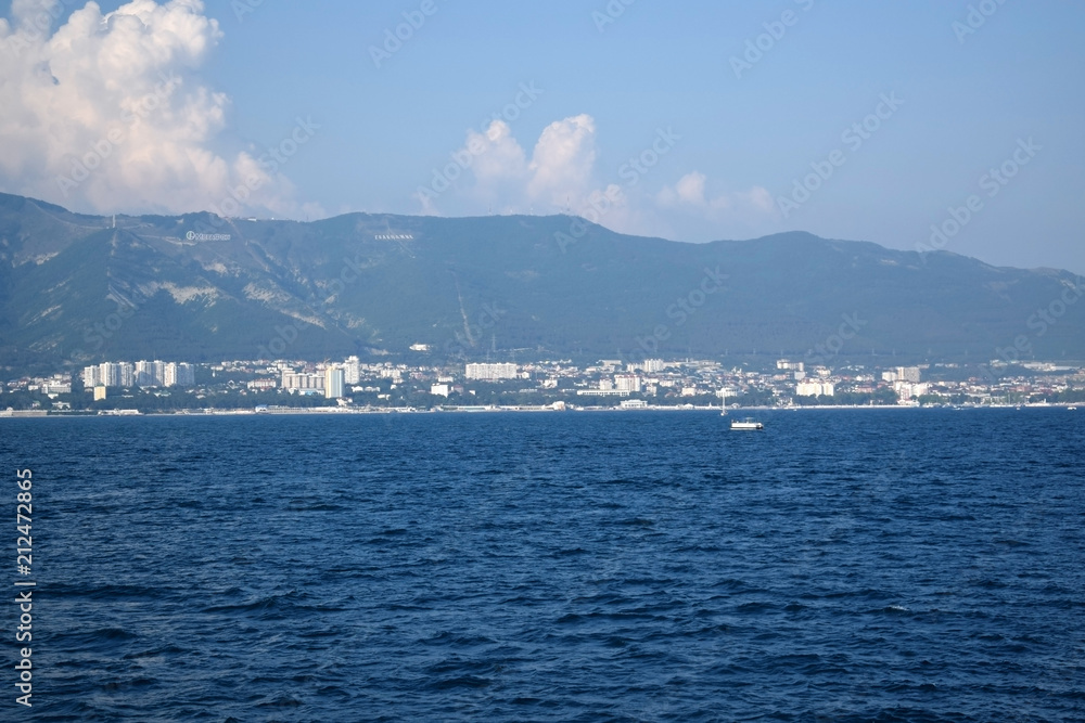 Gelendzhik, Russia - June 27, 2018: The view of the town and Markotkh ridge from the sea Gelendzhik, Russia - June 27, 2018: The view of the town and Markotkh ridge from the sea