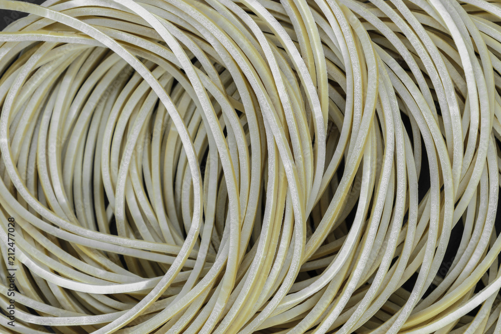 Many brown rubber rings placed one on each other background surface Many brown rubber rings placed one on each other background surface