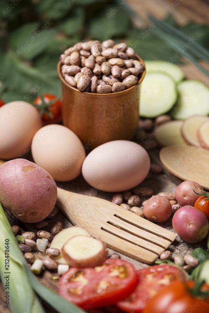 Food table with beans, eggs, tomato, potato and cucumber. Food table with beans, eggs, tomato, potato and cucumber.