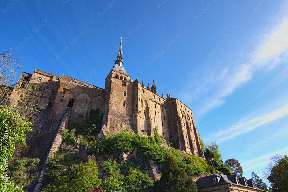 Wonderful wide angle view of ancient Mont Saint-Michel. View from a small park under the abbey. Normandy, France, Europe