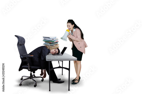 Female boss shouting to her exhausted employee