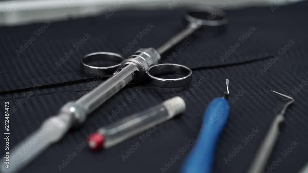 Doctor takes dental tools in dentist office clinic Doctor takes dental tools in dentist office clinic