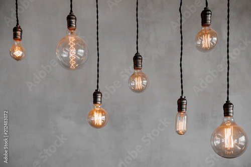 Edison retro lamp Incandescent bulbs on gray plaster wall background