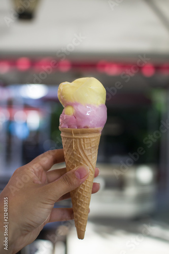 strawberry and lemon flavored ice cream in hands © Alsu