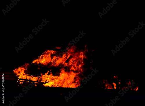 burning car on the road at night, a tragic accident ending with the ignition of a car