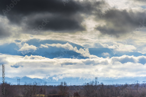 Dramatic clouds on the sky in the wintert photo