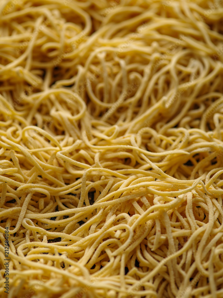 Dried egg noodles. Raw Fresh Spaghetti. Food background Dried egg noodles. Raw Fresh Spaghetti. Food background