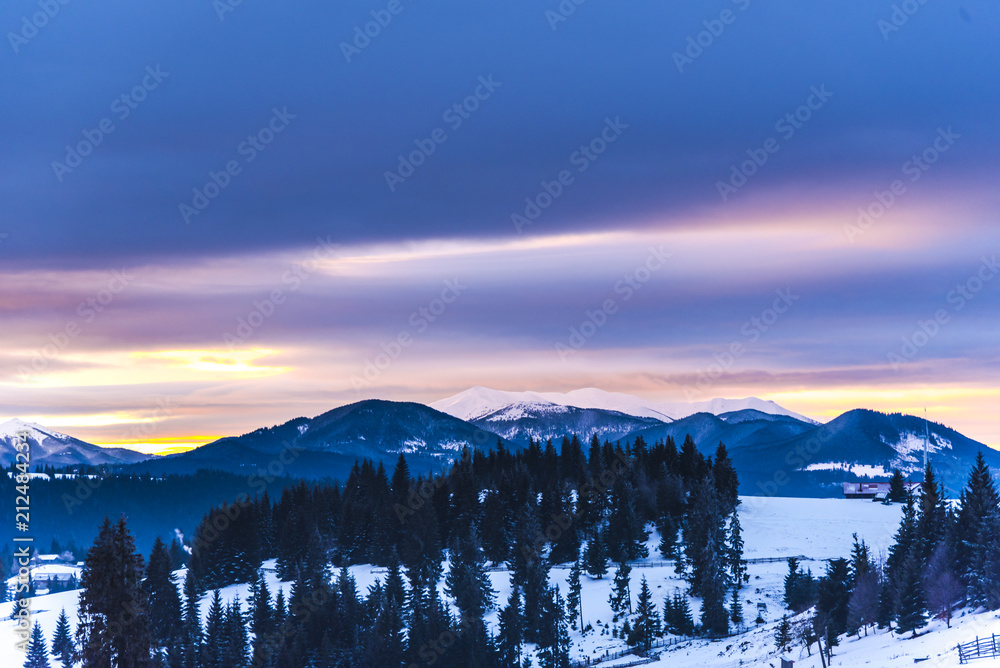 Fantastic colors of clouds at the sunset in Carpathians Mountains