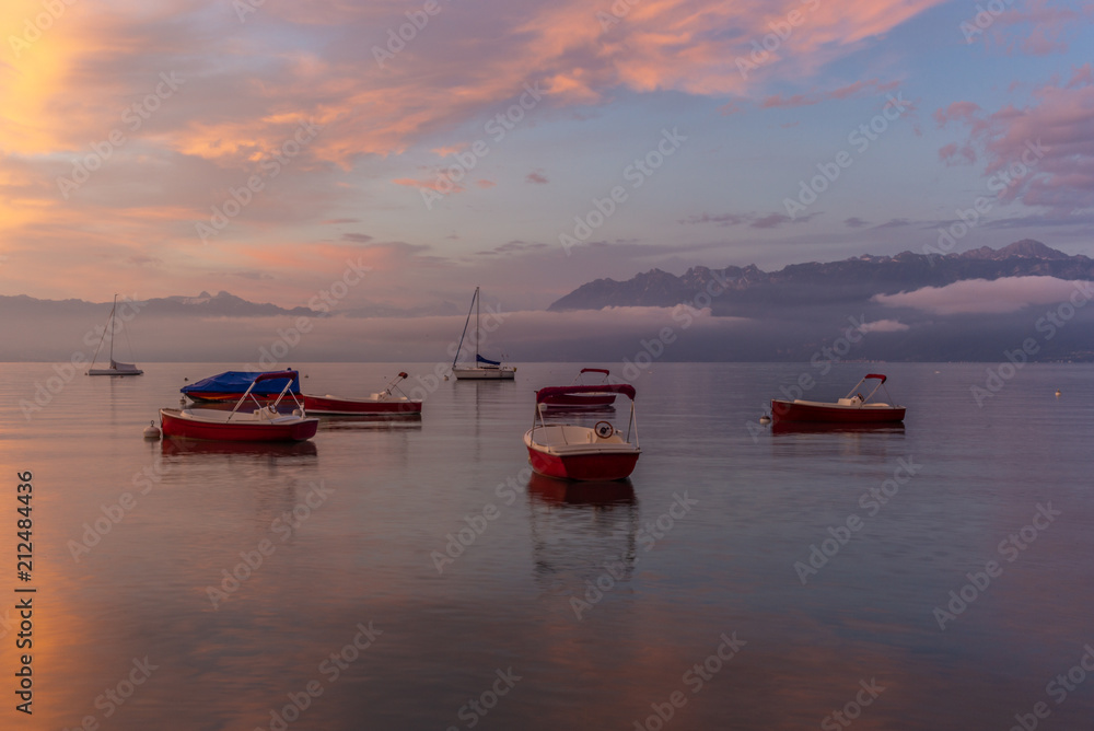 Colorful sunrise on the marina of Lausanne on the Lake Leman in summer with the view of the Swiss Alps in background - 8