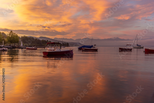 Colorful sunrise on the marina of Lausanne on the Lake Leman in summer with the view of the Swiss Alps in background - 6