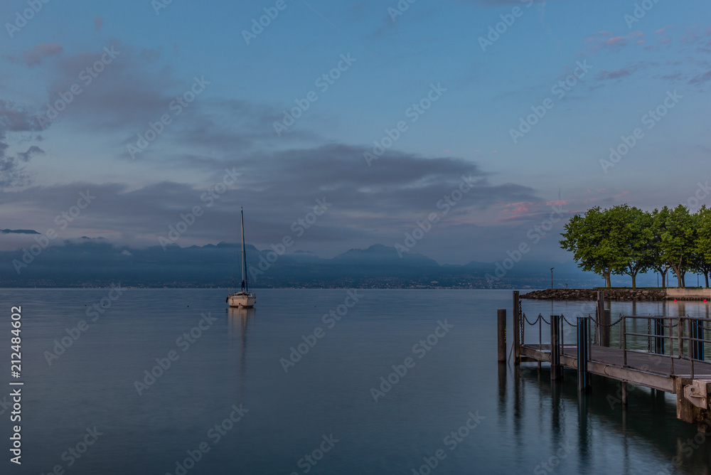 Colorful sunrise on the marina of Lausanne on the Lake Leman in summer with the view of the Swiss Alps in background - 14