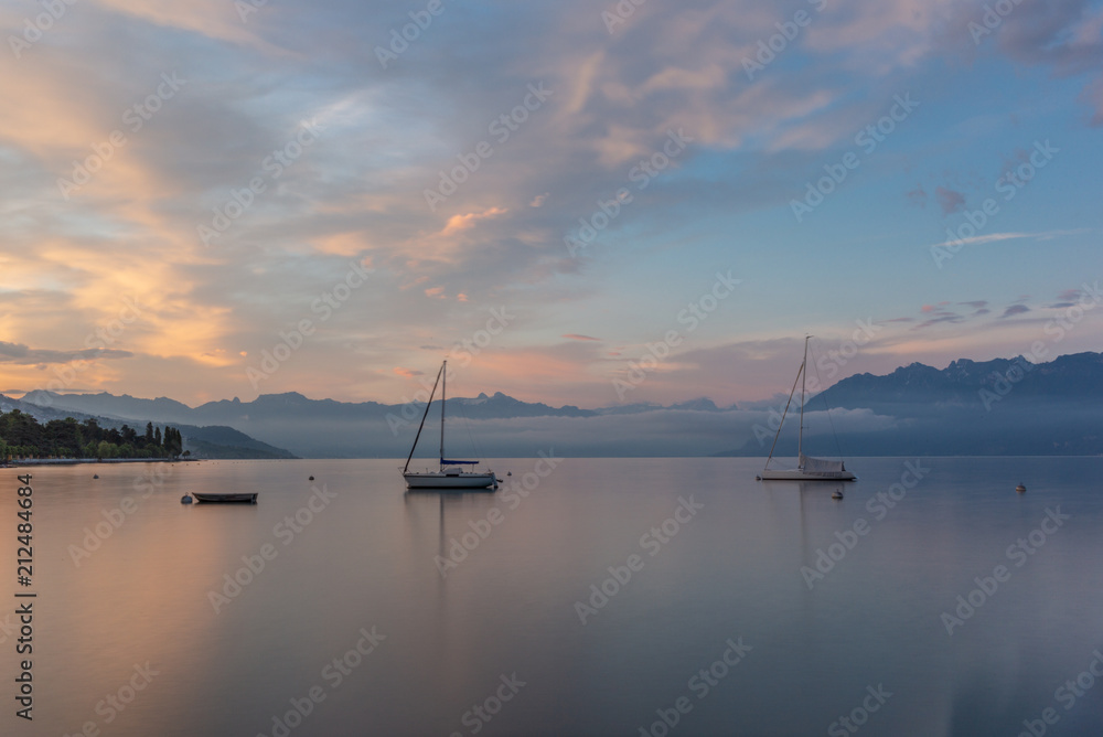 Colorful sunrise on the marina of Lausanne on the Lake Leman in summer with the view of the Swiss Alps in background - 18