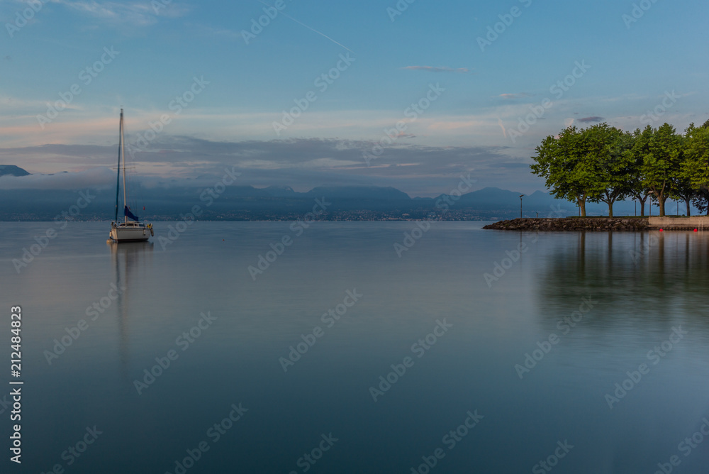 Colorful sunrise on the marina of Lausanne on the Lake Leman in summer with the view of the Swiss Alps in background - 23