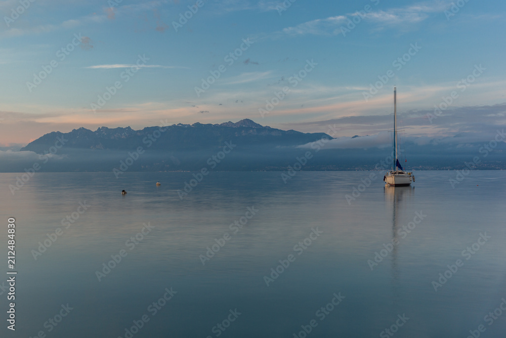 Colorful sunrise on the marina of Lausanne on the Lake Leman in summer with the view of the Swiss Alps in background - 24
