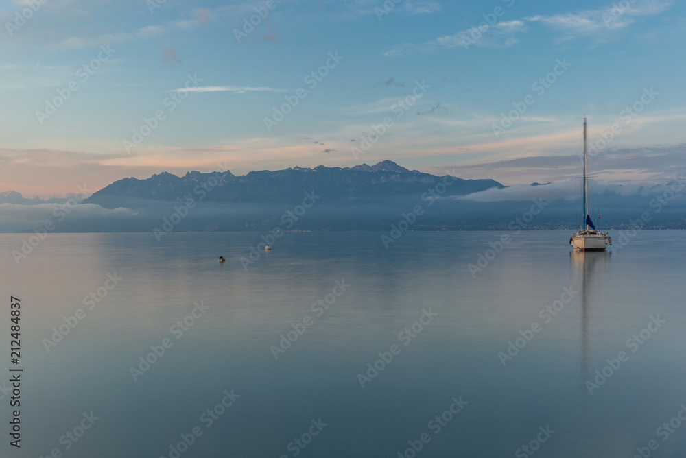Colorful sunrise on the marina of Lausanne on the Lake Leman in summer with the view of the Swiss Alps in background - 25