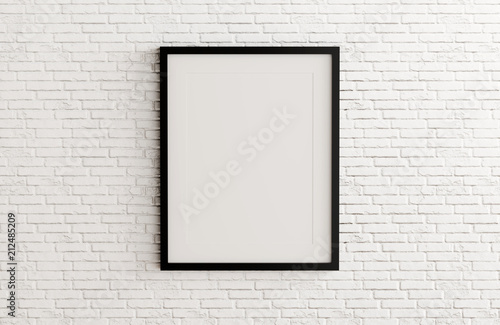 Blank black picture frame template for place image or text inside on white brick wall.
