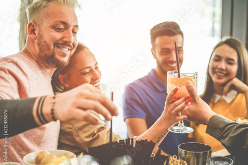 Canvas Print Happy young couples having fun at american bar in summer time