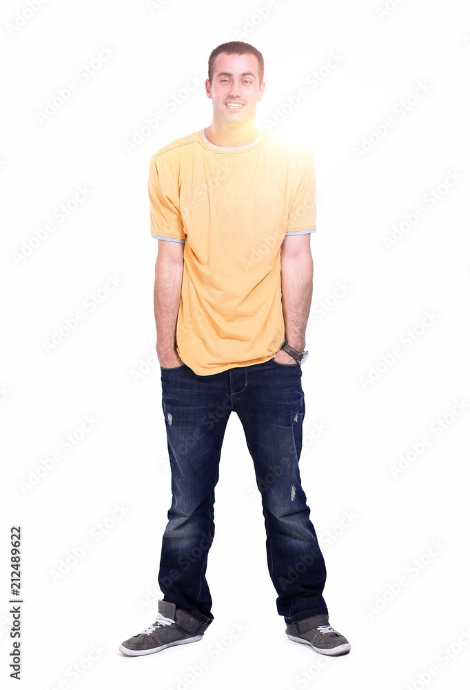 young man in a yellow t-shirt and jeans. young man in a yellow t-shirt and jeans.