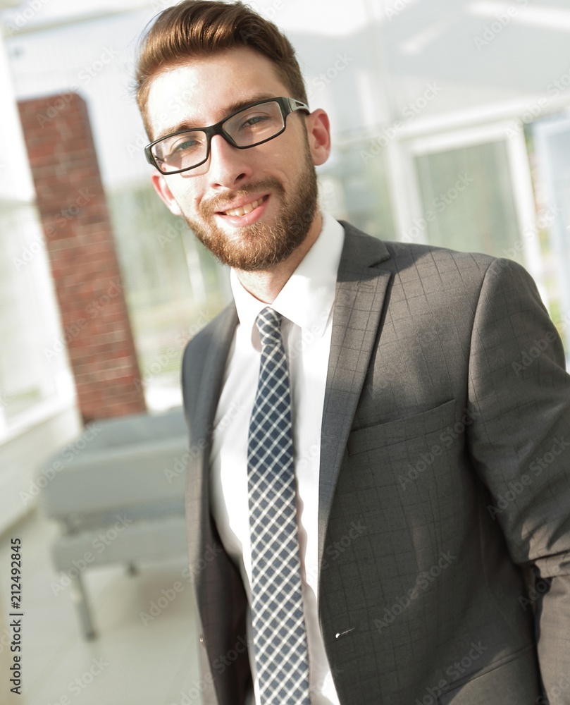Portrait of a modern businessman sitting at his desk. Portrait of a modern businessman sitting at his desk.