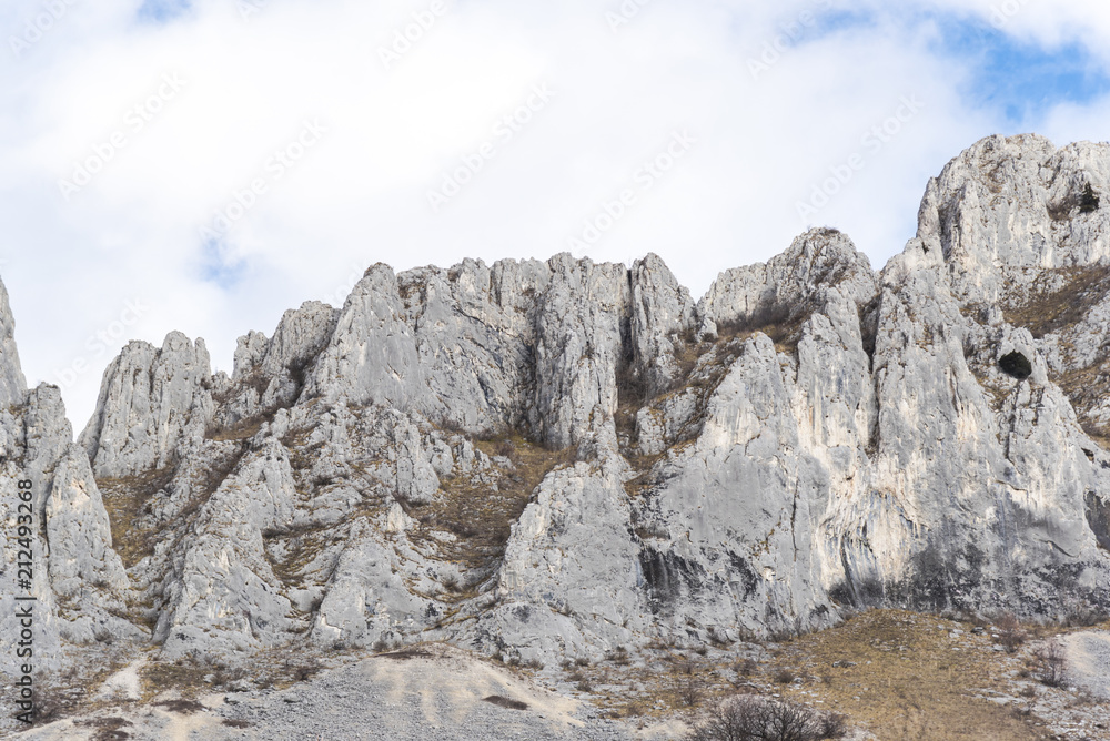 Fototapeta premium Mountains stone and white clouds