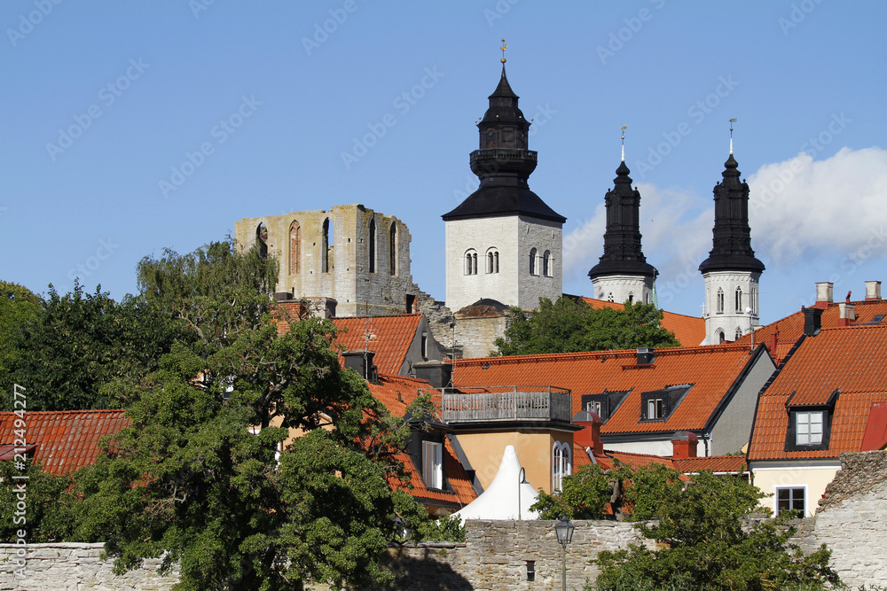 Towers of the Visby cathedral over the roof tops of medieval hanseatic town in Gotland Island, Sweden.