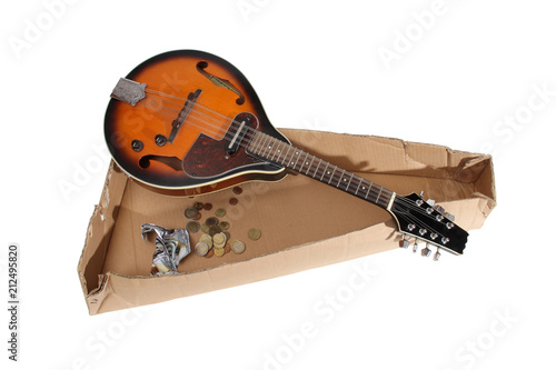 Mandolin and other things of a strolling musician on a white background