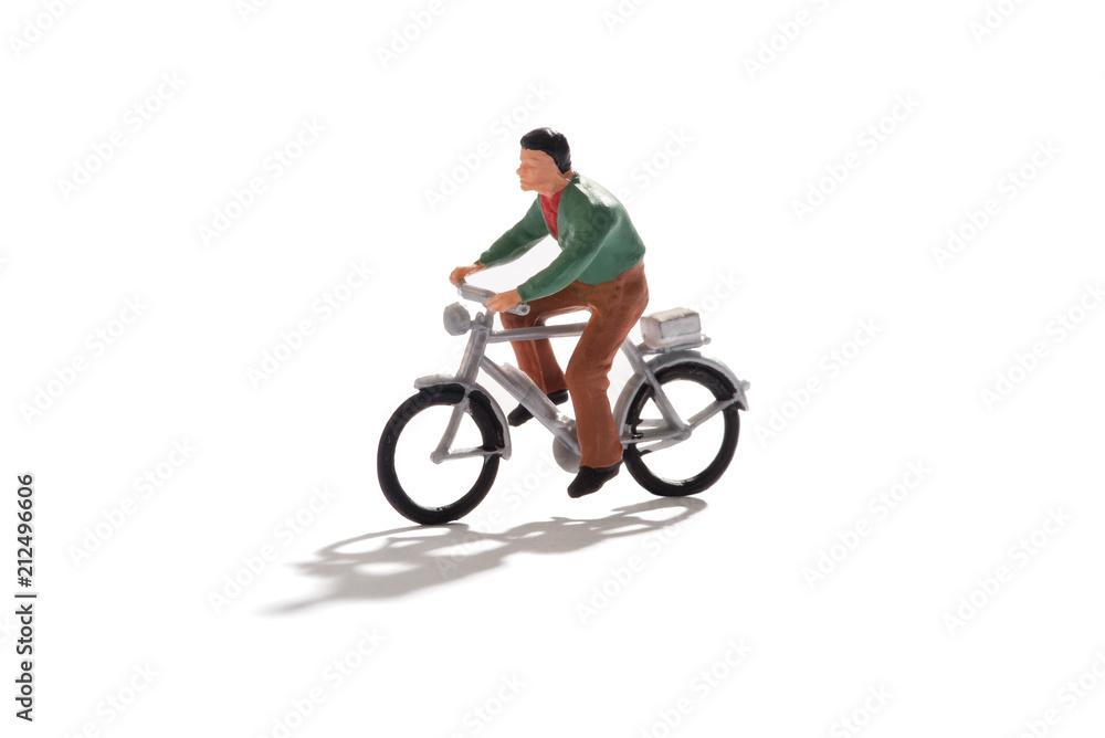 Miniature man riding a bicycle Miniature man riding a bicycle