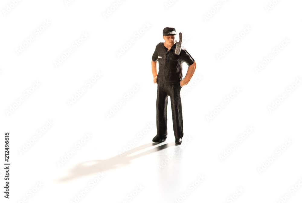 Miniature security guard with radio on duty Miniature security guard with radio on duty