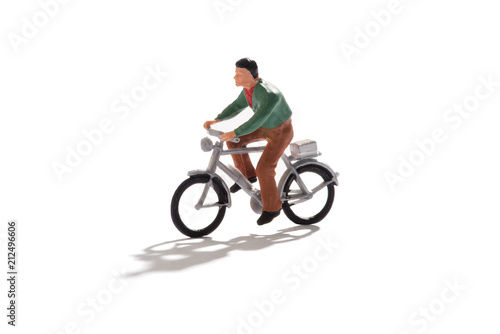 Miniature man riding a bicycle