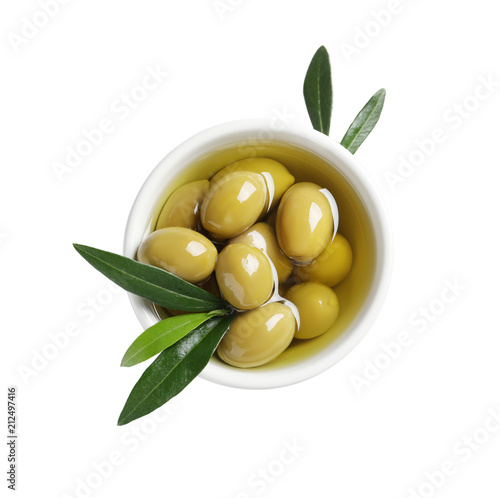 Obraz na plátně Bowl with fresh olives in oil on white background, top view